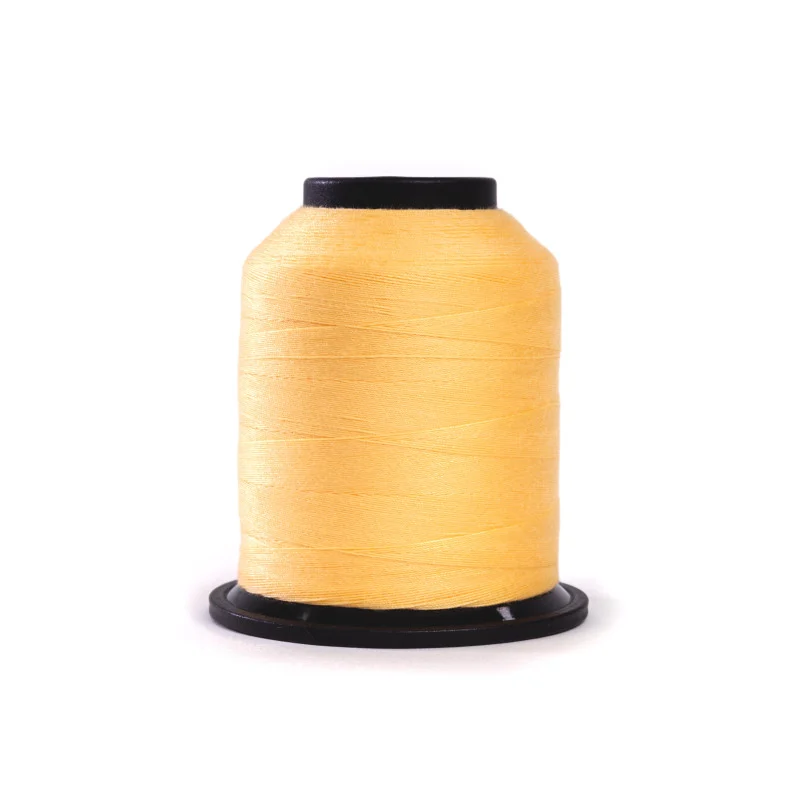 Grace Finesse 50 wt Polyester Thread – Straw Yellow – Soft straw yellow quilting thread on a 1,100-yard mini cone