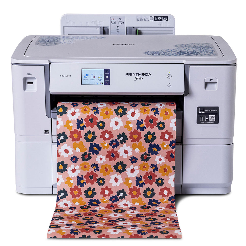 Brother HL-JF1 PrintModa studio fabric printer producing colorful floral printed fabric.